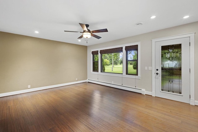 4350 S US Highway 45, Oshkosh, WI 54902 - spare room with a baseboard radiator, a ceiling fan, wood finished floors, and recessed lighting