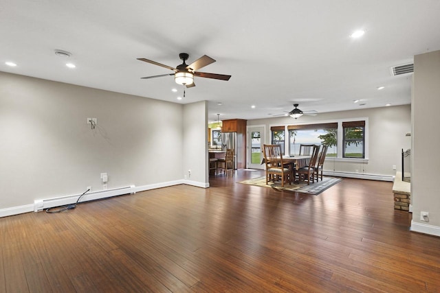 4350 S US Highway 45, Oshkosh, WI 54902 - living room featuring a ceiling fan, a baseboard heating unit, recessed lighting, and dark wood-type flooring