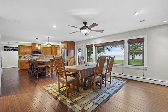 4350 S US Highway 45, Oshkosh, WI 54902 - dining space with a baseboard heating unit, dark wood-style floors, recessed lighting, and a ceiling fan