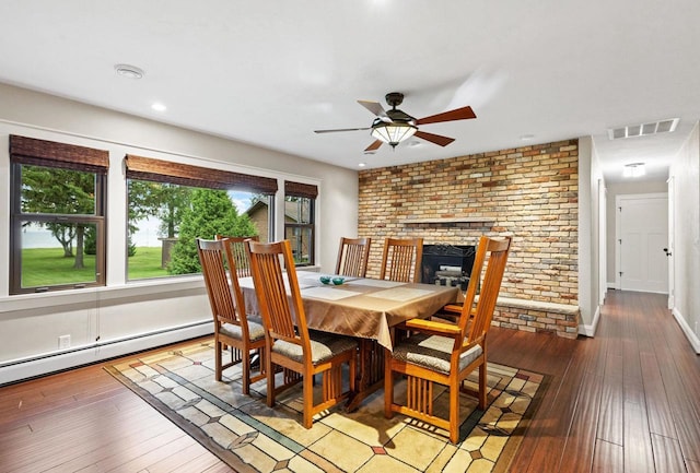 4350 S US Highway 45, Oshkosh, WI 54902 - dining space featuring plenty of natural light, ceiling fan, hardwood / wood-style floors, recessed lighting, and a brick fireplace