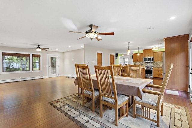 4350 S US Highway 45, Oshkosh, WI 54902 - dining space featuring baseboard heating, ceiling fan, light wood finished floors, and recessed lighting