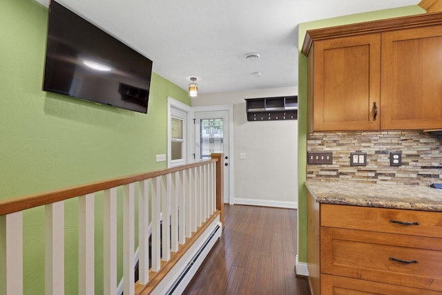 4350 S US Highway 45, Oshkosh, WI 54902 - corridor with baseboard heating and dark wood-style floors