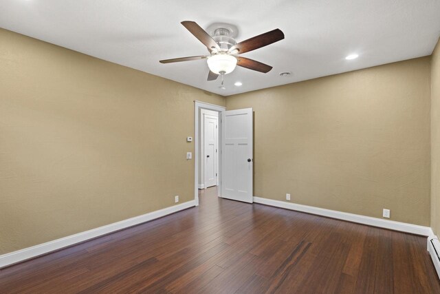 4350 S US Highway 45, Oshkosh, WI 54902 - spare room with dark wood finished floors, a ceiling fan, recessed lighting, and a baseboard radiator