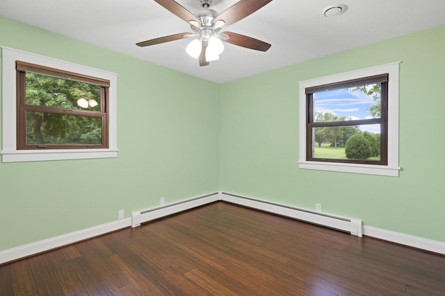 4350 S US Highway 45, Oshkosh, WI 54902 - unfurnished room with baseboard heating, healthy amount of natural light, wood finished floors, and a ceiling fan