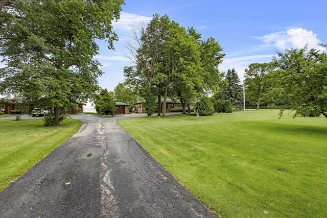 4350 S US Highway 45, Oshkosh, WI 54902 - obstructed view of property with a front yard and driveway