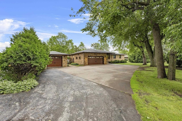 4350 S US Highway 45, Oshkosh, WI 54902 - view of front of house with brick siding, an attached garage, and concrete driveway