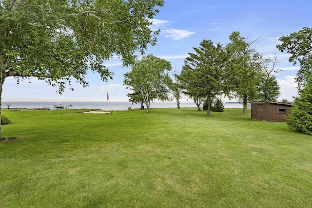 4350 S US Highway 45, Oshkosh, WI 54902 - view of grassy yard with a water view and an outbuilding