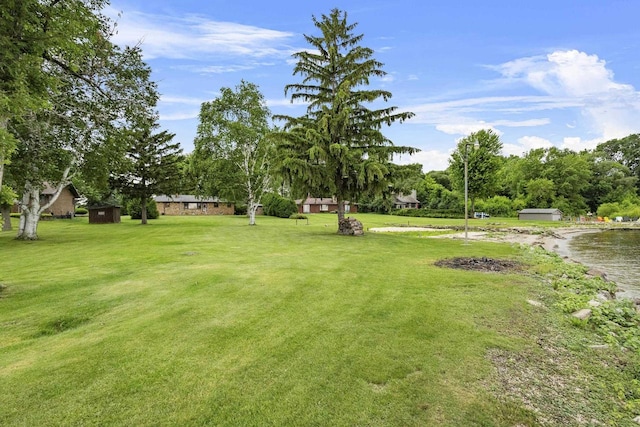 4350 S US Highway 45, Oshkosh, WI 54902 - view of green lawn featuring a storage shed and view of scattered trees