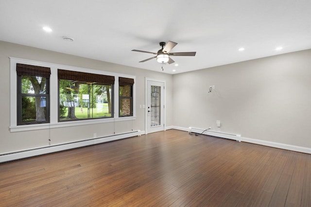 4350 S US Highway 45, Oshkosh, WI 54902 - empty room with a baseboard heating unit, ceiling fan, wood finished floors, and recessed lighting