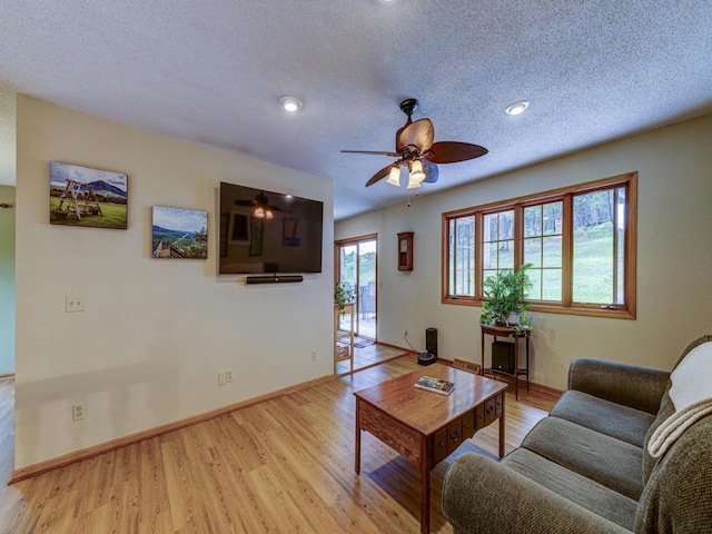 10811 S Patterson Rd, Solon Springs, WI 54873 - living area with a ceiling fan, light wood-style flooring, a textured ceiling, and recessed lighting