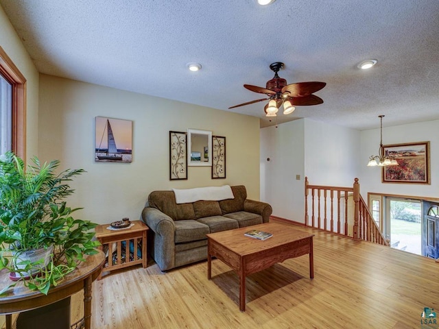 10811 S Patterson Rd, Solon Springs, WI 54873 - living area with light wood finished floors, a textured ceiling, a chandelier, ceiling fan, and recessed lighting