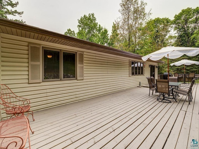 10811 S Patterson Rd, Solon Springs, WI 54873 - wooden deck featuring outdoor dining space