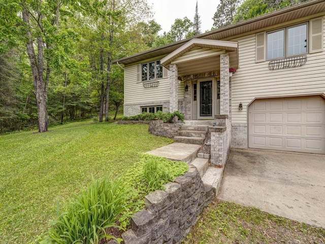 10811 S Patterson Rd, Solon Springs, WI 54873 - bi-level home featuring a garage, a front yard, and driveway