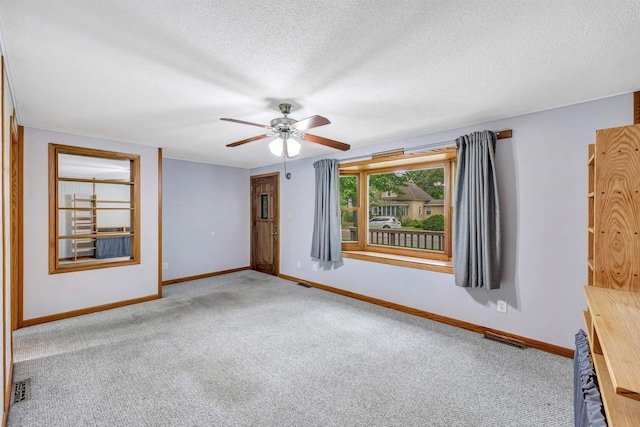 172 S Pierce St, Adams, WI 53910 - carpeted spare room featuring a ceiling fan and a textured ceiling