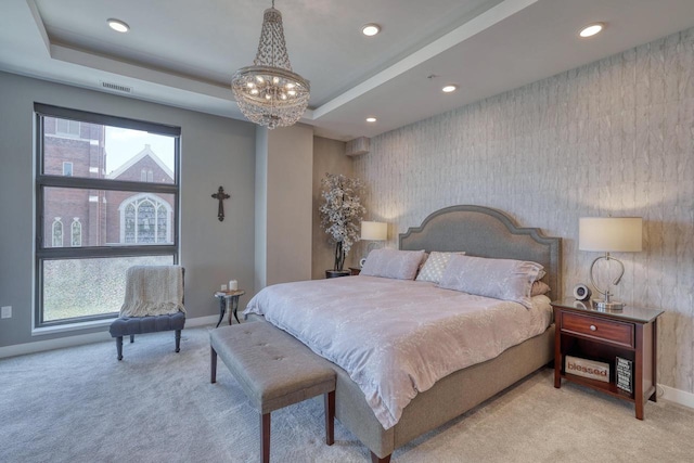 215 E Pleasant St Unit 304, Oconomowoc, WI 53066 - carpeted bedroom featuring a chandelier, multiple windows, recessed lighting, and an accent wall