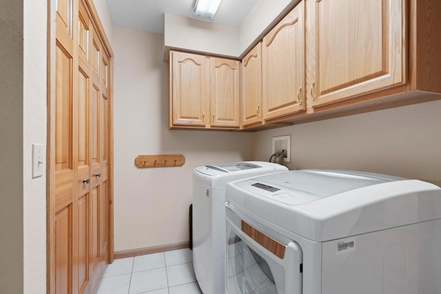 5330 Deer Trail Ln, Sheboygan, WI 53083 - washroom with cabinet space, independent washer and dryer, and light tile patterned floors