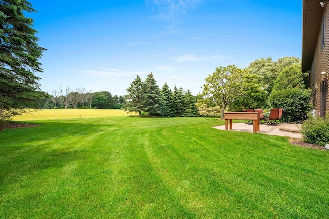 5330 Deer Trail Ln, Sheboygan, WI 53083 - view of green lawn featuring a patio and view of scattered trees