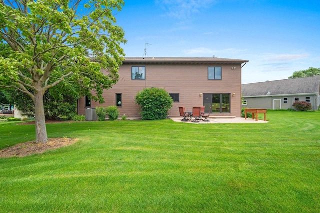 5330 Deer Trail Ln, Sheboygan, WI 53083 - back of house with a patio area and a lawn
