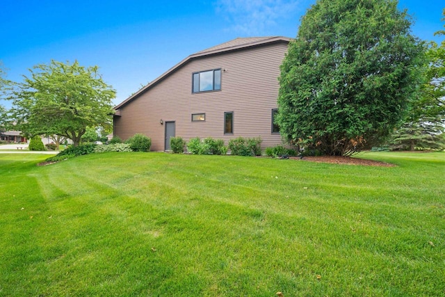 5330 Deer Trail Ln, Sheboygan, WI 53083 - view of property exterior with a lawn