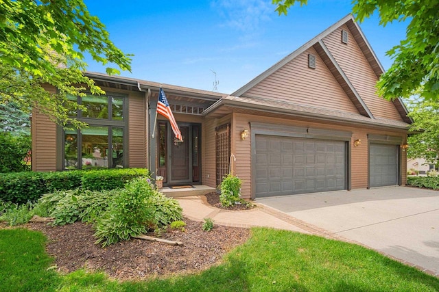 5330 Deer Trail Ln, Sheboygan, WI 53083 - view of front of home with a garage and concrete driveway
