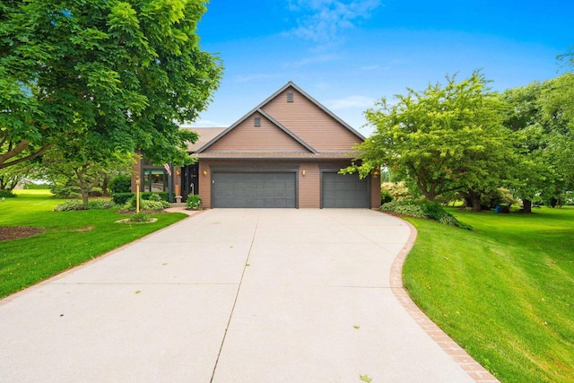 5330 Deer Trail Ln, Sheboygan, WI 53083 - view of front of property with a front yard, concrete driveway, and an attached garage