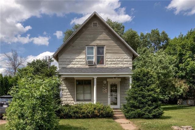 324 Mead St, Eau Claire, WI 54703 - view of front facade featuring a front lawn, cooling unit, and covered porch