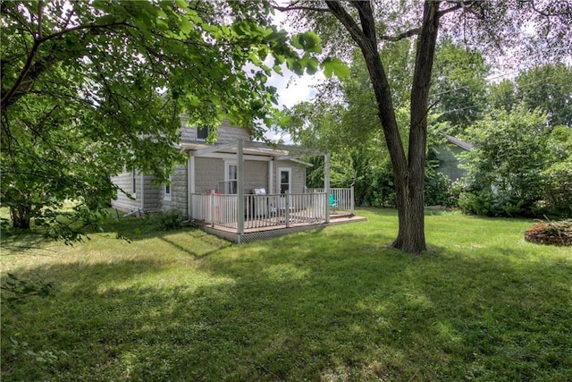 324 Mead St, Eau Claire, WI 54703 - view of grassy yard with a deck and a pergola