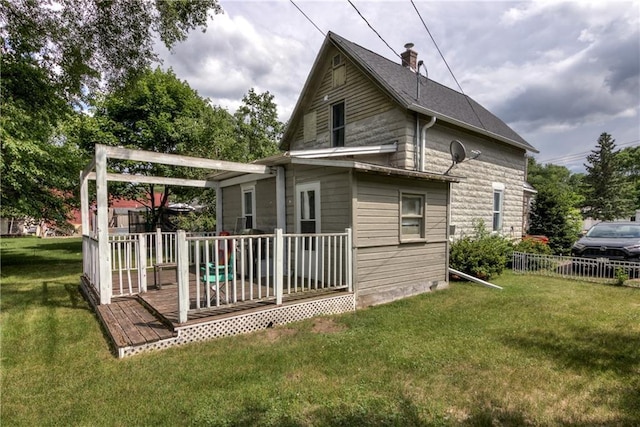 324 Mead St, Eau Claire, WI 54703 - rear view of house featuring a wooden deck and a chimney