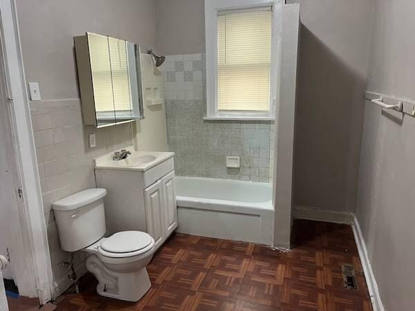 2847 N 26th St, Milwaukee, WI 53206 - full bathroom featuring vanity, bathtub / shower combination, and tile walls