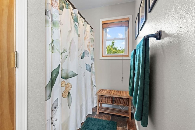 1630 Central St, Oshkosh, WI 54901 - full bathroom featuring stone finish floors and a shower with curtain