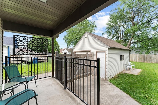 1630 Central St, Oshkosh, WI 54901 - view of patio featuring an outbuilding and a detached garage