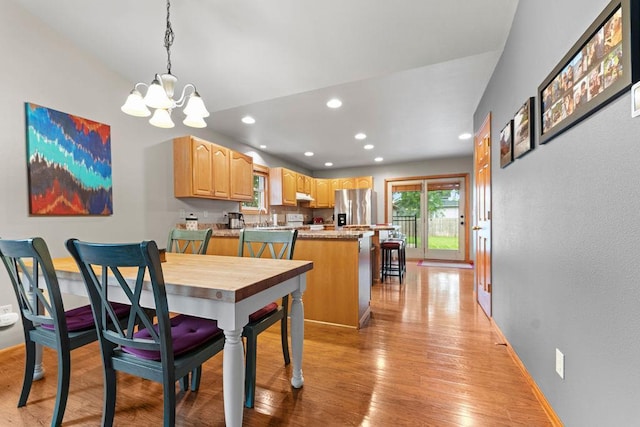 1630 Central St, Oshkosh, WI 54901 - dining area featuring a chandelier, recessed lighting, and light wood-type flooring