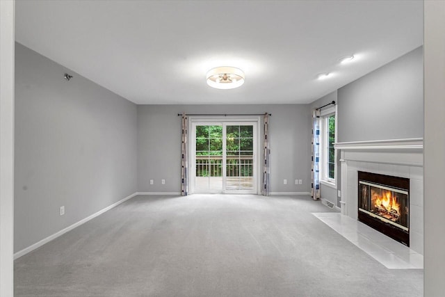 2855 River Birch Dr Unit D, Brookfield, WI 53045 - unfurnished living room with a tiled fireplace and carpet floors