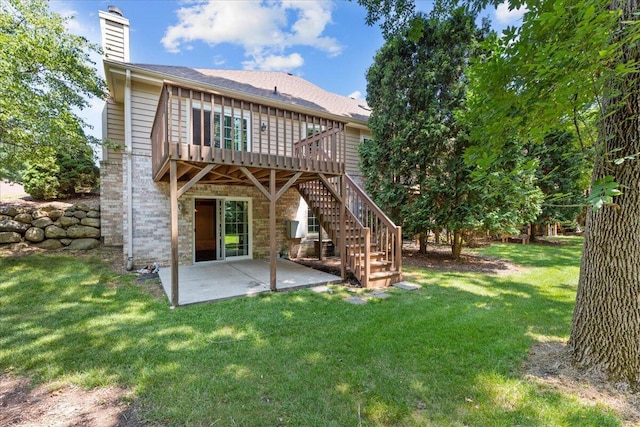 2855 River Birch Dr Unit D, Brookfield, WI 53045 - rear view of house with a chimney, a patio area, a yard, stairway, and a wooden deck