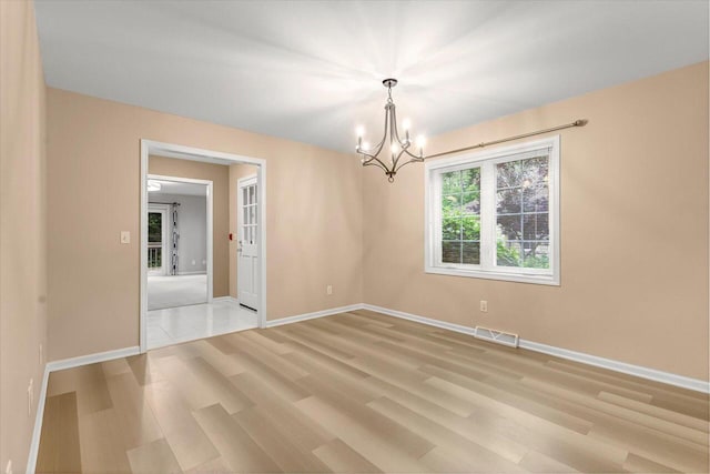 2855 River Birch Dr Unit D, Brookfield, WI 53045 - unfurnished room with a chandelier and light wood finished floors