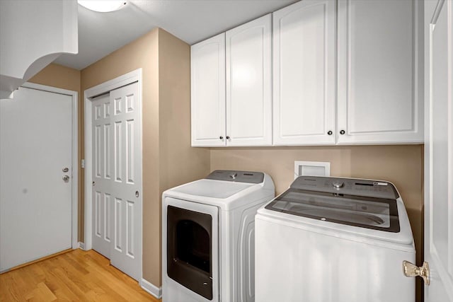2855 River Birch Dr Unit D, Brookfield, WI 53045 - laundry room with separate washer and dryer, cabinet space, and light wood-style floors