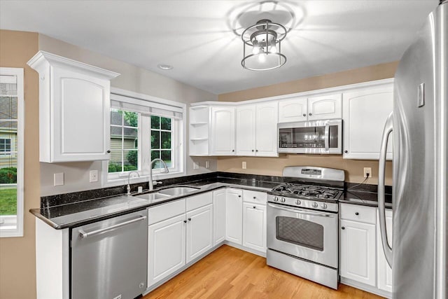 2855 River Birch Dr Unit D, Brookfield, WI 53045 - kitchen with stainless steel appliances, white cabinetry, light wood-style flooring, and open shelves