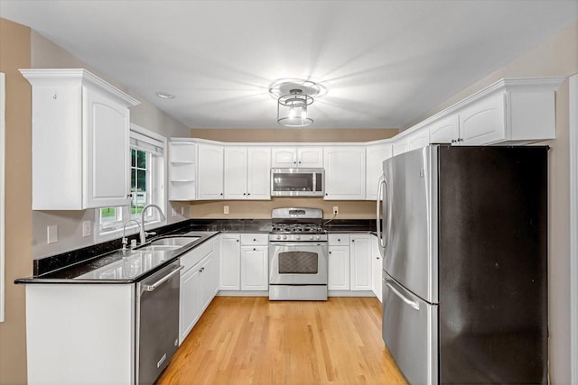 2855 River Birch Dr Unit D, Brookfield, WI 53045 - kitchen with stainless steel appliances, light wood finished floors, white cabinets, open shelves, and recessed lighting