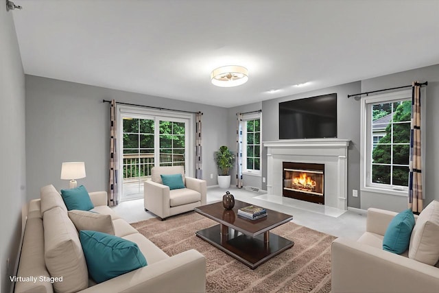2855 River Birch Dr Unit D, Brookfield, WI 53045 - living room with a glass covered fireplace, plenty of natural light, and light carpet