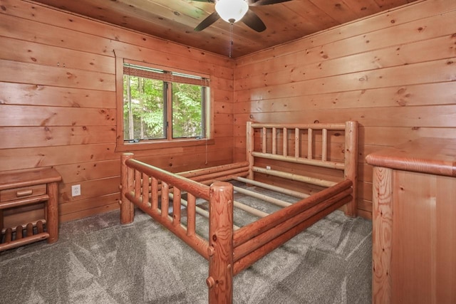 1780 Amik Lake Ln, Lac Du Flambeau, WI 54538 - bedroom with carpet floors, wood walls, wood ceiling, and a sauna / steam room