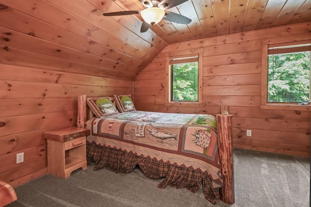 1780 Amik Lake Ln, Lac Du Flambeau, WI 54538 - carpeted bedroom featuring wooden ceiling, lofted ceiling, wooden walls, and ceiling fan