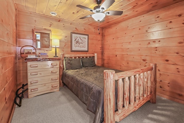 1780 Amik Lake Ln, Lac Du Flambeau, WI 54538 - bedroom featuring light carpet, wood walls, and wooden ceiling