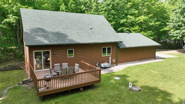 1780 Amik Lake Ln, Lac Du Flambeau, WI 54538 - rear view of property with roof with shingles, a lawn, and a wooden deck