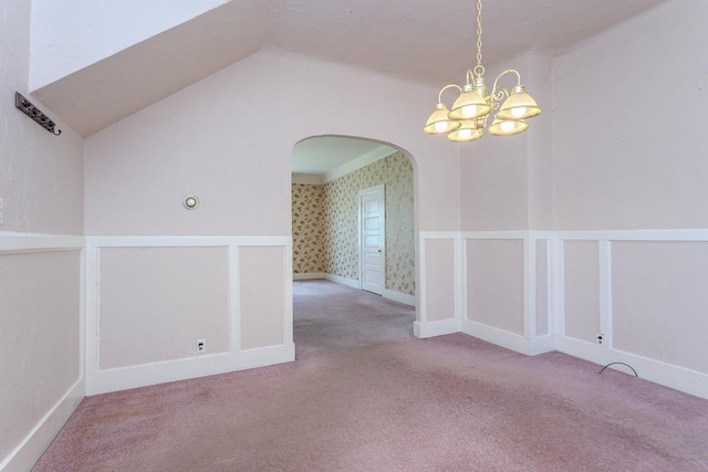 305 N Center Ave, Merrill, WI 54452 - carpeted spare room featuring arched walkways, a chandelier, and vaulted ceiling