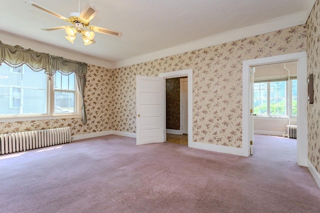 305 N Center Ave, Merrill, WI 54452 - unfurnished bedroom with radiator, carpet flooring, and a ceiling fan