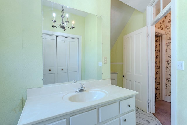 305 N Center Ave, Merrill, WI 54452 - bathroom with vanity and a chandelier