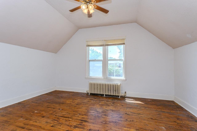 305 N Center Ave, Merrill, WI 54452 - additional living space with radiator, ceiling fan, wood finished floors, and vaulted ceiling