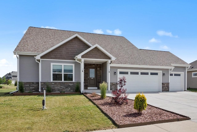 1451 Whalen Dr, Oconomowoc, WI 53066 - craftsman inspired home with a garage, concrete driveway, a front lawn, and stone siding