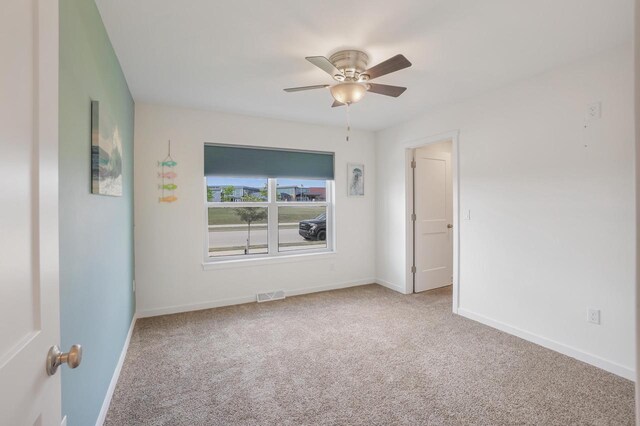 1451 Whalen Dr, Oconomowoc, WI 53066 - spare room featuring carpet and ceiling fan