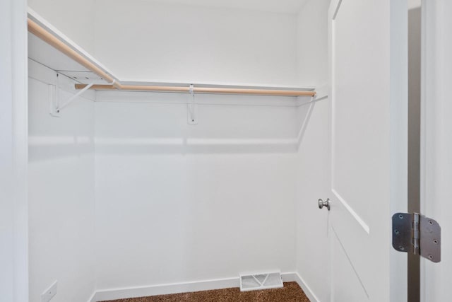 1451 Whalen Dr, Oconomowoc, WI 53066 - spacious closet featuring dark colored carpet